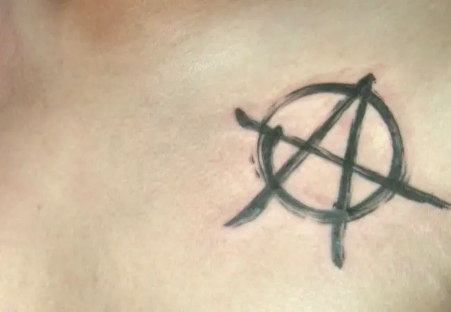 Anarchy Tattoo on left chest